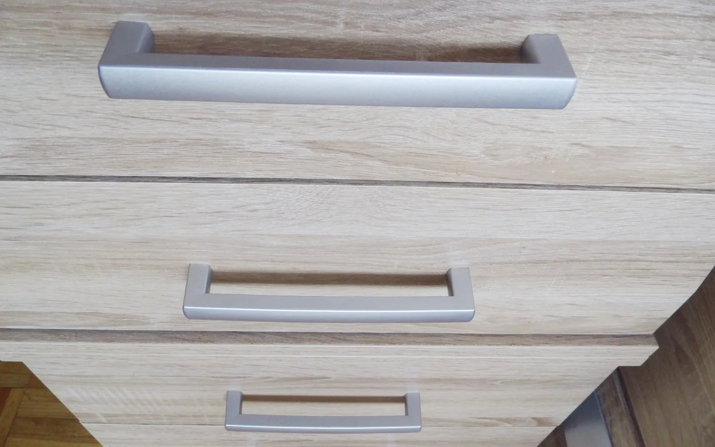 Furniture panel and handle reference photo for material, finish, and hardware approval